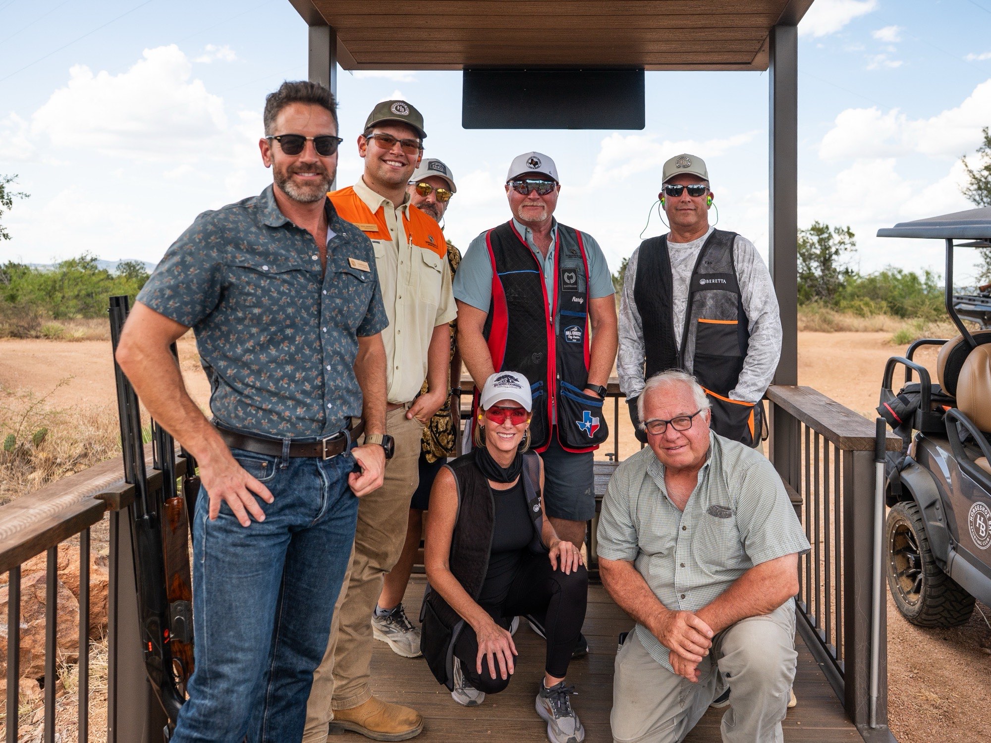 A squad of members gathered on a shooting stand